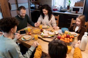 Christain Family Doing Prayer Before Having Food