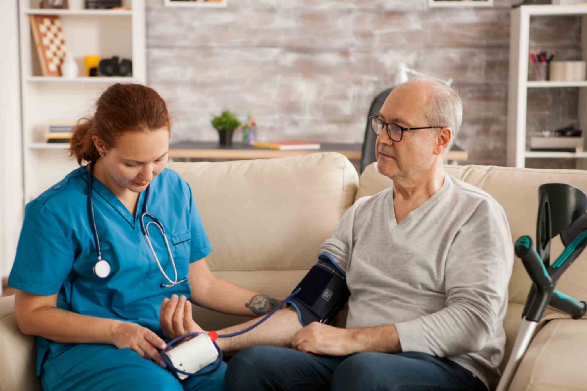 Female Nurse Checking The Patient