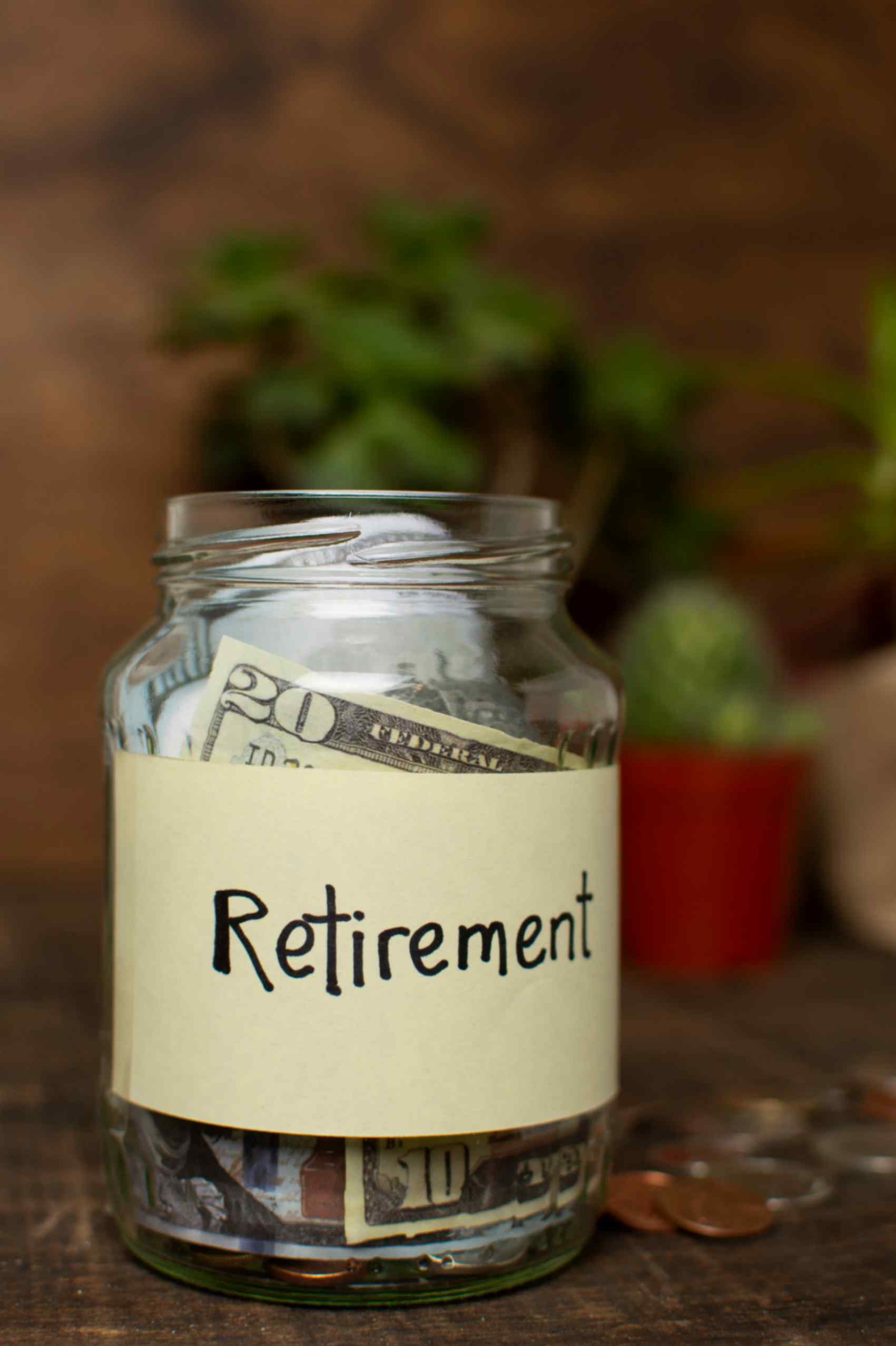 Jar Filled With Saved Money For Retirement