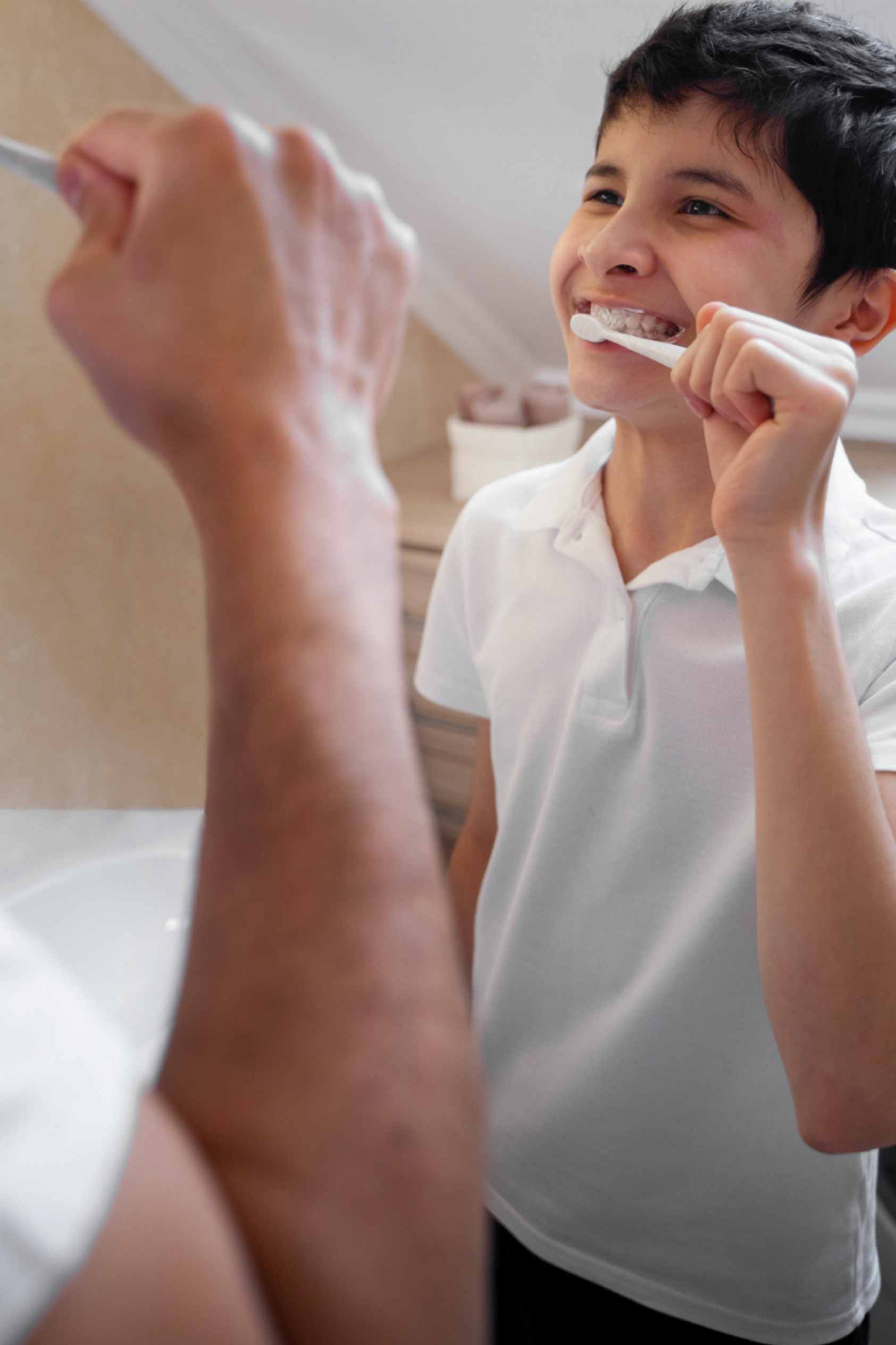 Kid is Brushing His Teeth With His Father