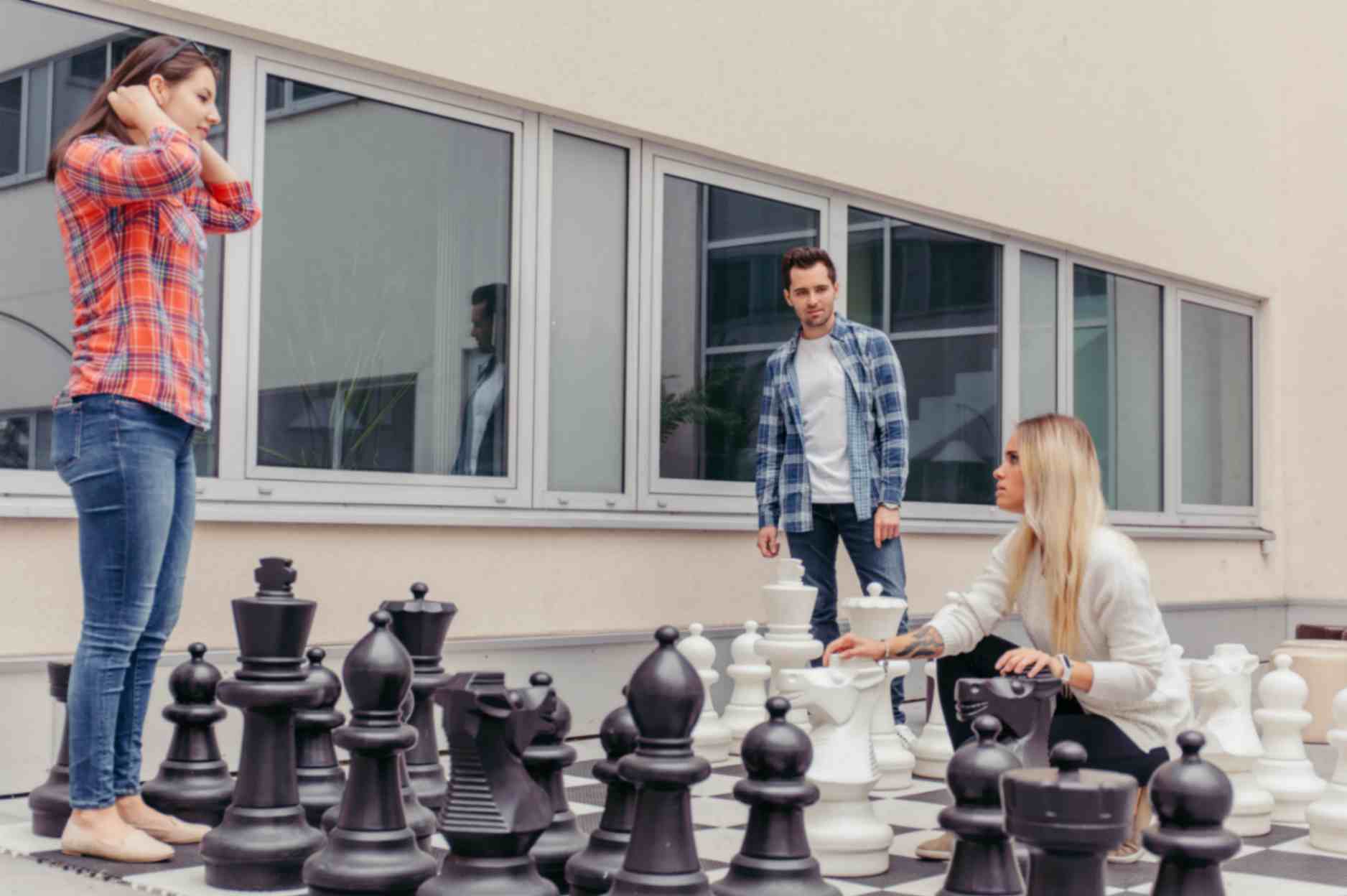 Kids playing large chess after class