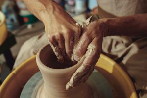 Old Women Making Vase through Clay