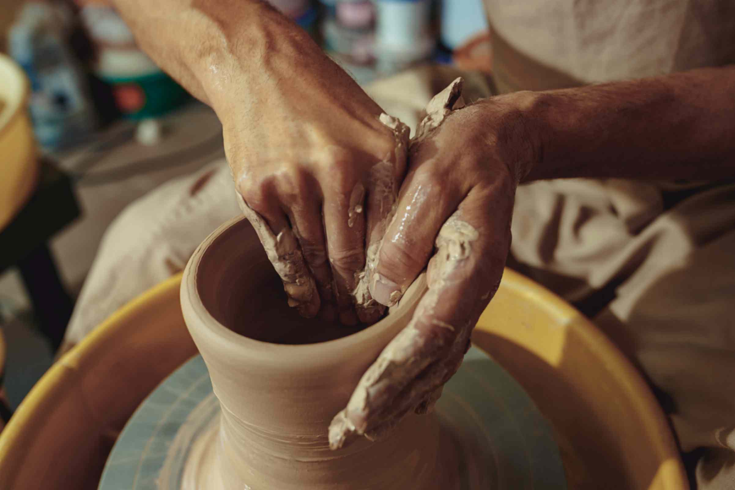 Old Women Making Vase through Clay