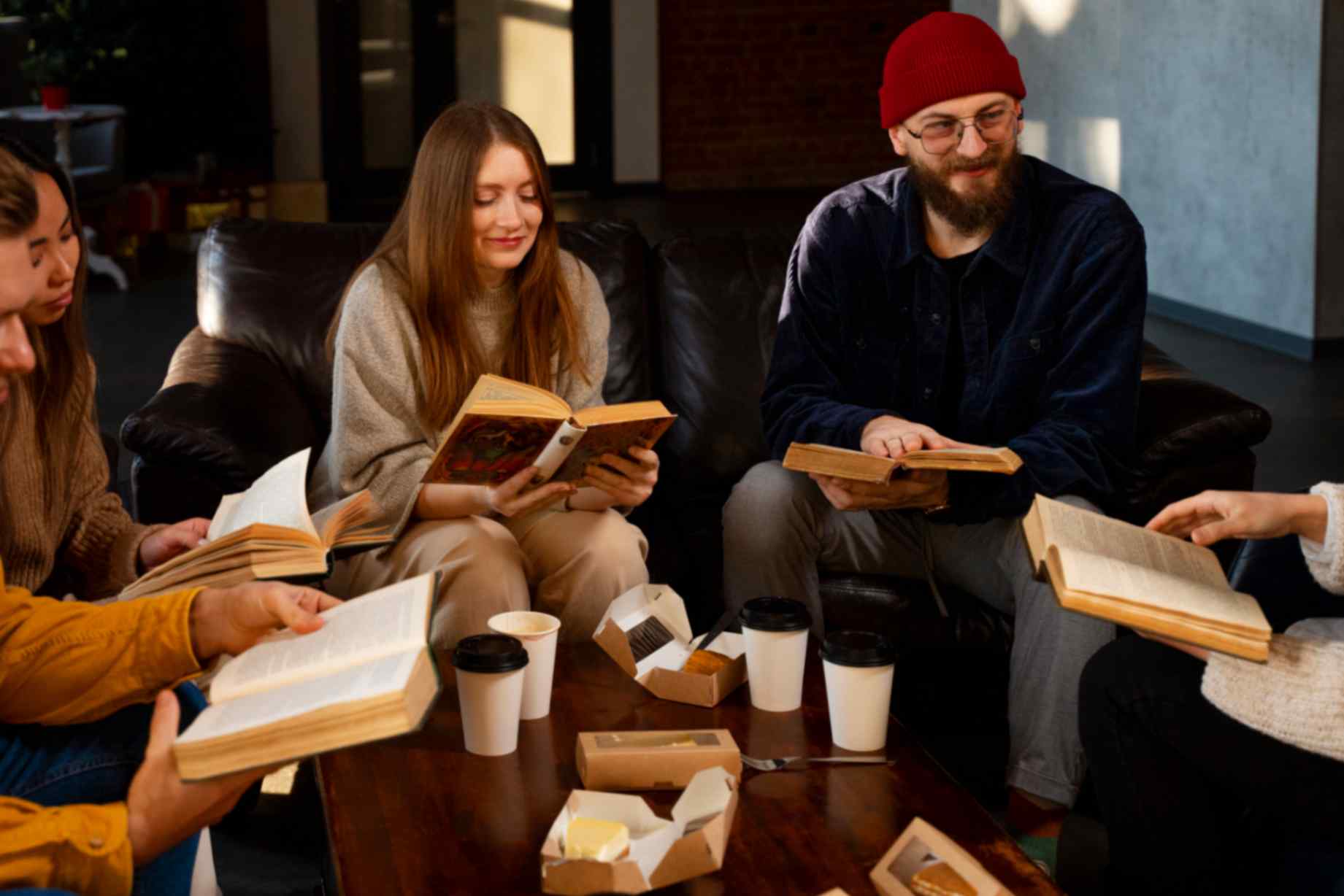 Picture of people reading books together and having tea