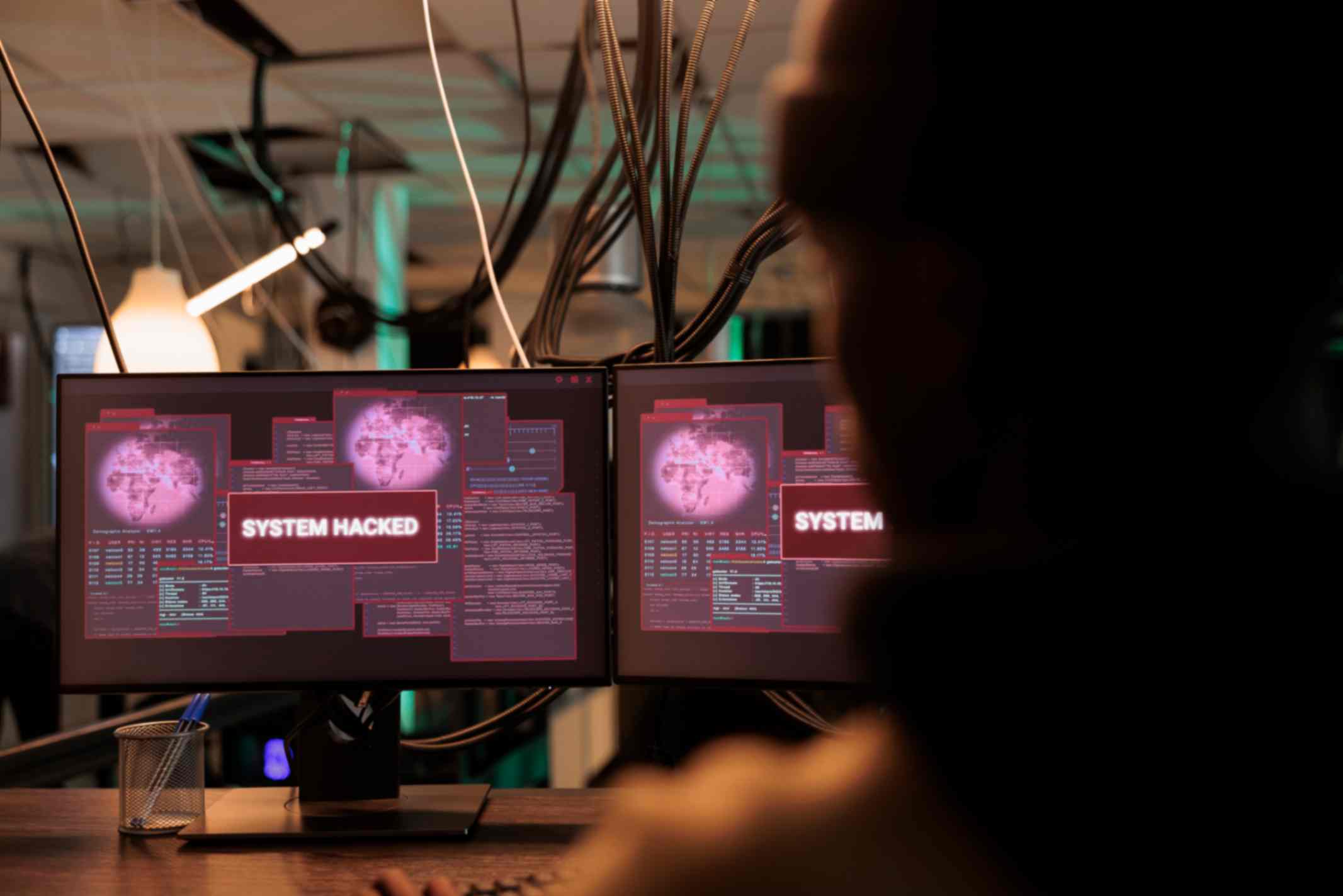 System hacked Alert message on computer screen. Hacker breaking into database server