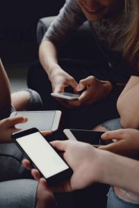 Teenagers Using Mobile Phone