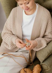 Women Knitting a Sweater